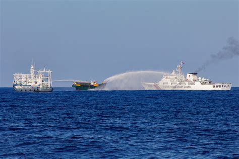 Chinese coast guard ships fire water cannons and .